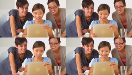 开心的中国商业女性使用平板电脑高清在线视频素材下载