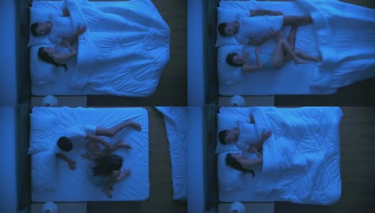 一个受惊吓的男人和一个女人躺在床上。晚上晚上时间高清在线视频素材下载