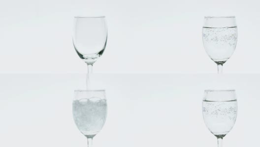 Pouring soda water into a clear glass.高清在线视频素材下载