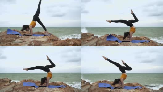 4k/年轻的亚洲苗条女子瑜伽在日落的海滩上，日出的背景。健身、运动、瑜伽和健康理念。高清在线视频素材下载