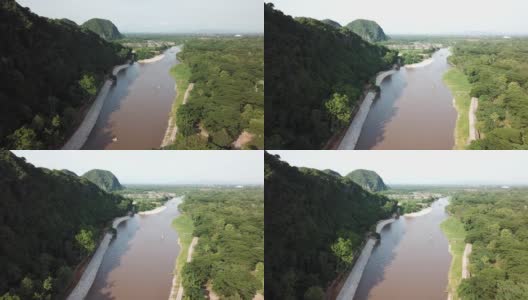 鸟瞰图长尾船在角河，这条河流经泰国清莱市。高清在线视频素材下载