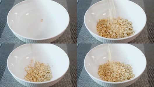 美味的粥谷落入白色陶瓷碗中高清在线视频素材下载