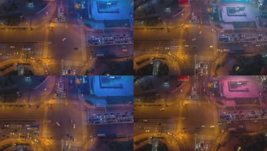 夜光照亮青岛市区交通街道十字路口高空俯仰全景4k中国高清在线视频素材下载