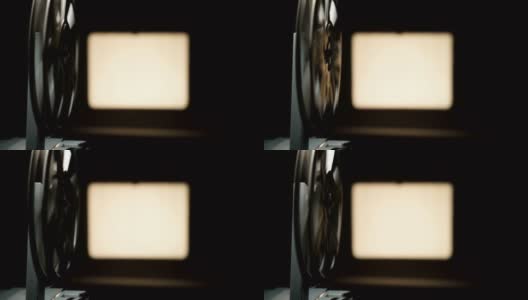 旧电影放映机在黑色背景上拍摄的录像高清在线视频素材下载