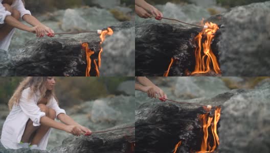 女人在独特的Yanartas山火上烤棉花糖高清在线视频素材下载