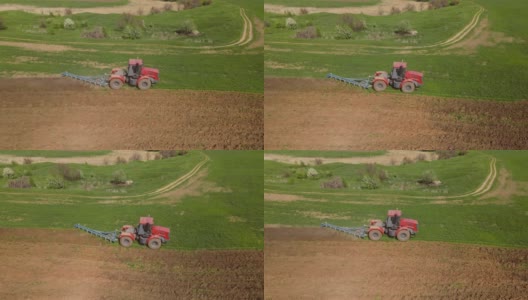 红色拖拉机正用耙子松动地面，防止土壤干燥，平整地面，消灭杂草，准备季节性种植小麦，无人机从高度、侧面拍摄高清在线视频素材下载