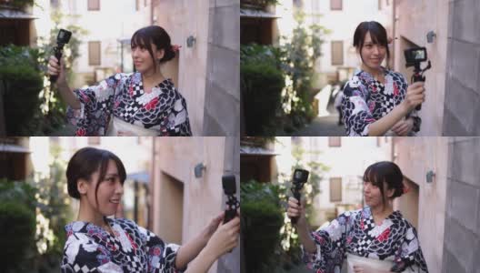 一名日本女子在一条狭窄的小路上发视频高清在线视频素材下载