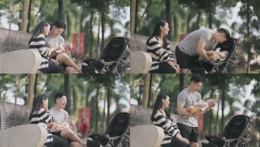 亚洲华人父母周末早上在公园里和他们的孩子亲密无间高清在线视频素材下载