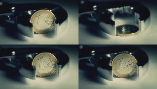金融危机与欧元:用夹子夹住硬币高清在线视频素材下载