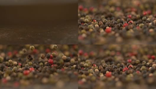 慢动作，DOF:芬芳的花椒籽落在平底锅里，弹跳着。高清在线视频素材下载