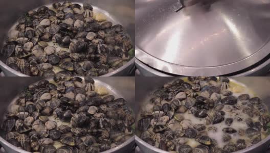 煮蛤蜊，倒白葡萄酒高清在线视频素材下载