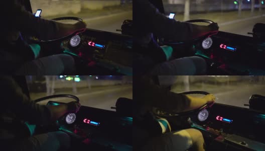 公交车司机晚上在城市街道上使用智能手机乘坐城际长途汽车高清在线视频素材下载