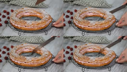 自制泡芙糕点巴黎布雷斯特与覆盆子。法国甜点。高清在线视频素材下载