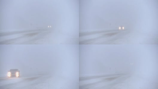 冬季高速公路上有暴风雪。汽车在雪地里行驶。高清在线视频素材下载