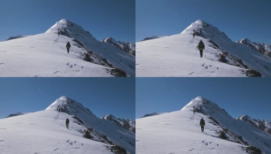 在吉尔吉斯斯坦，登山家们登上了雪山的顶峰高清在线视频素材下载