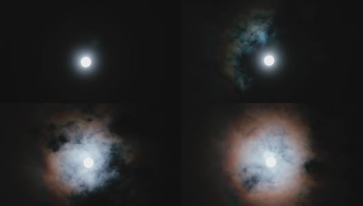 月亮在夜空中随云的时间流逝。高清在线视频素材下载