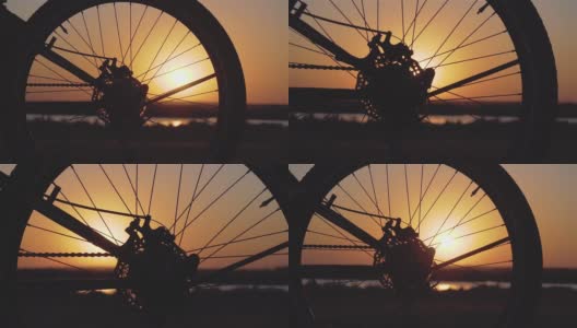 自行车车轮和女脚鞋在春天的晚上骑在城外照顾环境在日落慢动作高清在线视频素材下载