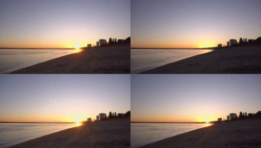 从建筑后面的日出。黎明在河边。间隔拍摄。高清在线视频素材下载