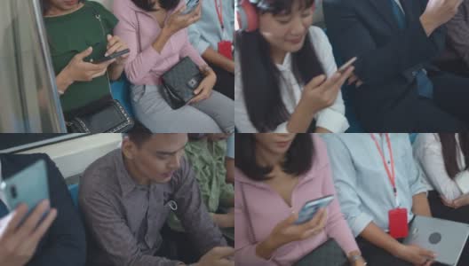 亚洲人在乘坐地铁时使用智能手机，特写高清在线视频素材下载