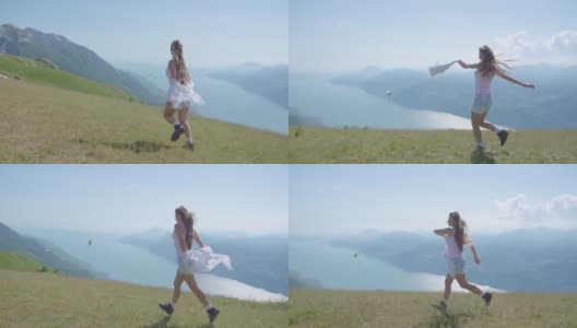 一个小女孩在加尔达湖的山上奔跑高清在线视频素材下载
