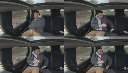 男人坐在车里系好安全带高清在线视频素材下载