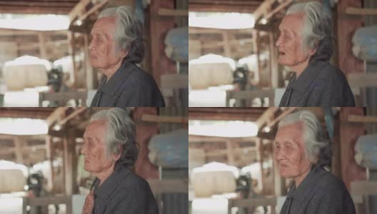 中等近距离拍摄的年长妇女与短灰头发坐在和谈论在当地的家，亚洲资深妇女的肖像，老年妇女的概念高清在线视频素材下载