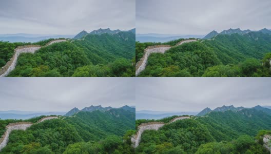 长城和绿色的山在夏季，多云的景色。平移镜头(延时)高清在线视频素材下载