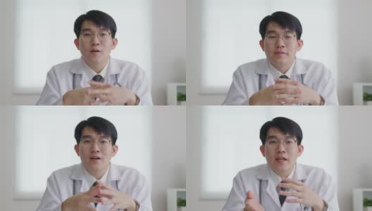 POV友好的亚洲男医生视频通话在线交谈看着摄像机。高清在线视频素材下载