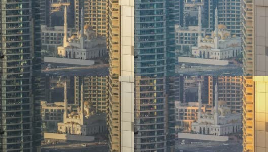 在阿联酋迪拜的迪拜码头上，摩天大楼之间的Al Raheem清真寺高清在线视频素材下载