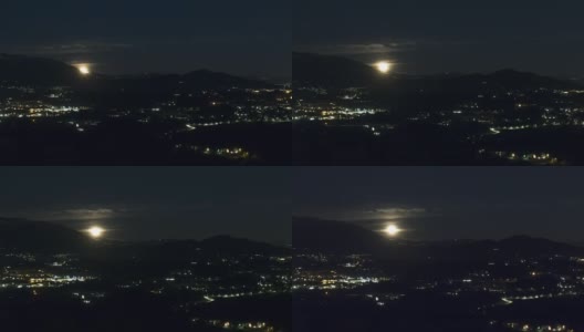 夜晚从山后升起的满月(或超级月亮)的时间间隔高清在线视频素材下载