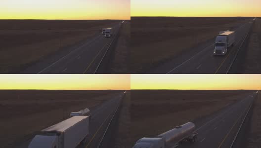 航拍图:黎明时分，卡车货运和汽车在公路上行驶高清在线视频素材下载