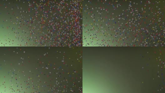 慢动作:多色颗粒下落和反弹在绿色bg高清在线视频素材下载