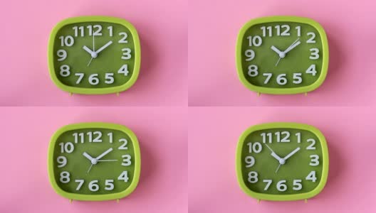 粉红色背景上的白色数字和箭头的绿色时钟高清在线视频素材下载
