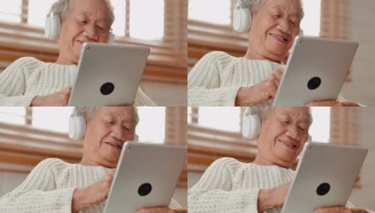 亚洲老年女性患者在家里用平板电脑与医生进行视频会议。老年假期、技术、人、退休、生活方式、全球、医学教育、医疗咨询、医疗保健和医学概念。高级技术高清在线视频素材下载