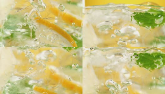 气泡挤过柠檬水成分的玻璃-微距镜头高清在线视频素材下载