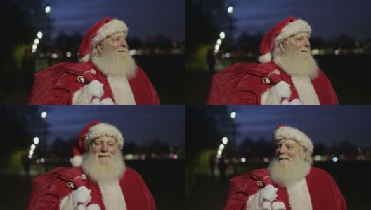 圣诞老人的特写，红润的脸颊和一包礼物高清在线视频素材下载
