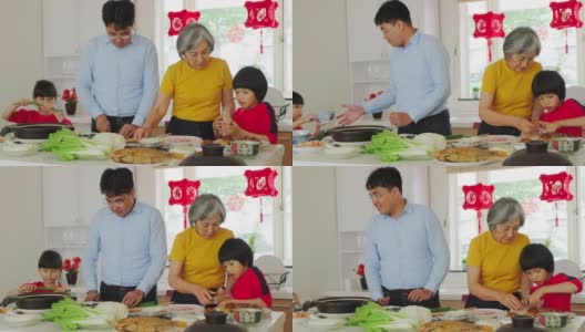 中国一家几代人在厨房里准备新年食物高清在线视频素材下载