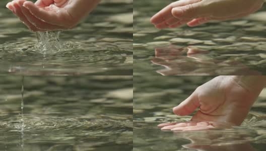 慢动作特写:手抓住和举起水晶清澈的水高清在线视频素材下载