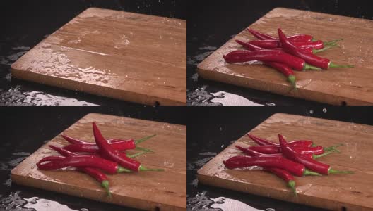 红辣椒落在木头上。Slowmotion高清在线视频素材下载