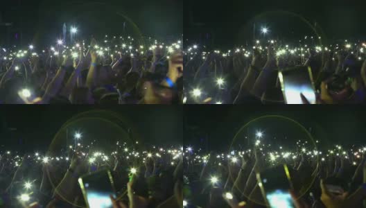 背景-观众与手电筒的智能手机在摇滚音乐会高清在线视频素材下载