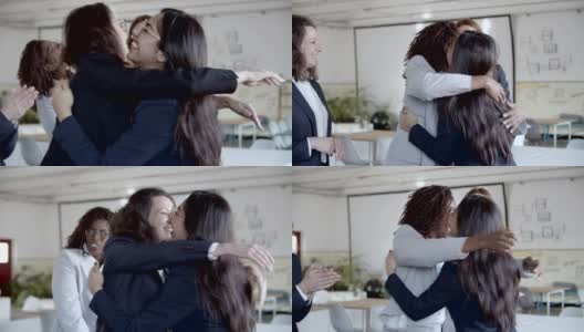 商界女性在办公室拥抱并取得胜利高清在线视频素材下载