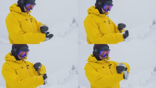 滑雪板运动员重新调整他的手套高清在线视频素材下载