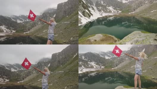 游客在Robiei湖与瑞士国旗高清在线视频素材下载