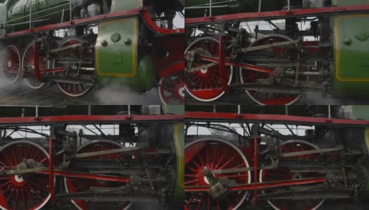 老式蒸汽机的车轮、烟雾、蒸汽和声音。高清在线视频素材下载