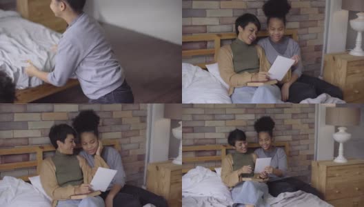 一个非洲女儿在公寓里画贺卡给她的妈妈惊喜，作为母亲节的礼物高清在线视频素材下载