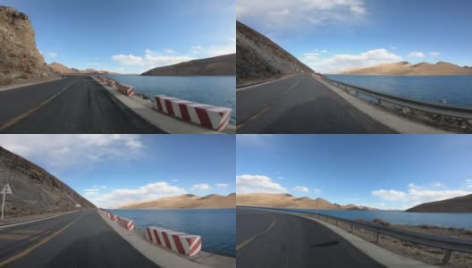 在中国西藏羊卓雍错湖边的小路上行驶高清在线视频素材下载