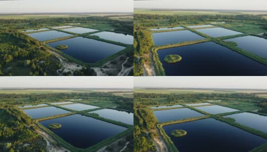 鸟瞰图保留池，湿池，湿滞留池或雨水管理池，是一个人工池塘周围植被，并在其设计中包括一个永久水池高清在线视频素材下载