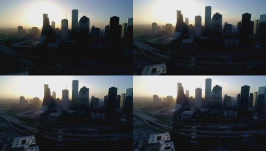 休斯顿，德克萨斯州无人机在日出轮廓天际线与金色旭日升起在背景高清在线视频素材下载