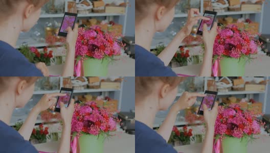 一名女子用智能手机拍下一束美丽的鲜花。高清在线视频素材下载