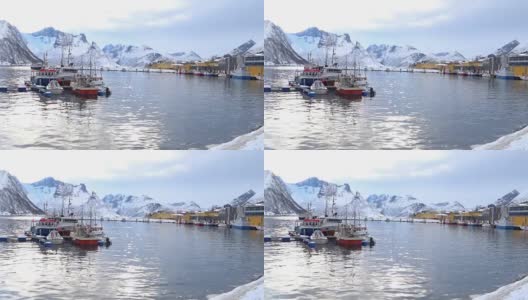 冬季，挪威北部Senja岛Øyfjorden的Husøy渔港和村庄高清在线视频素材下载